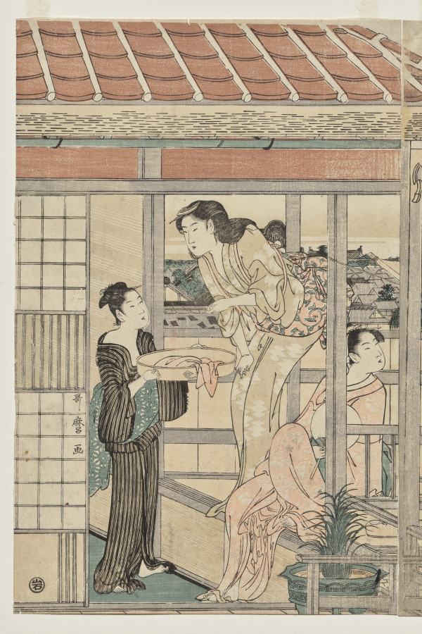 Women Hanging Laundry to Dry on a Balcony