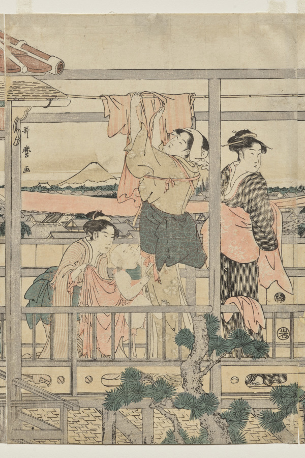 Women Hanging Laundry to Dry on a Balcony